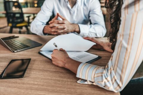 A Client and a Lawyer Review Documents Together, Discussing Parental Plans in Treasure Coast, FL